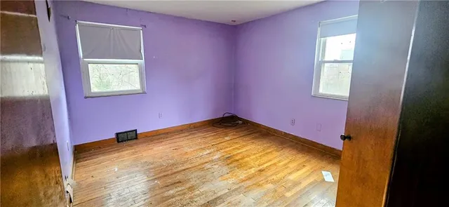 a utility room with a sink and washing machine