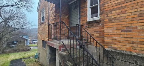 a view of a brick building with many windows