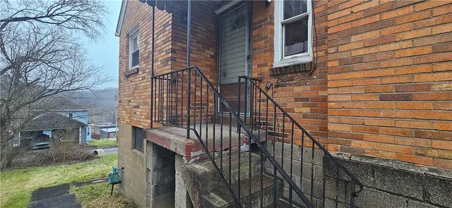 a view of a brick building with many windows
