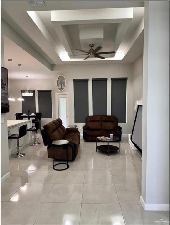 3120 East Rabbit Run Avenue Alton, TX 78573 - Photo 13 of 21 a living room with furniture and a large window