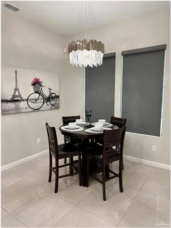 a view of a dining room and a chandelier