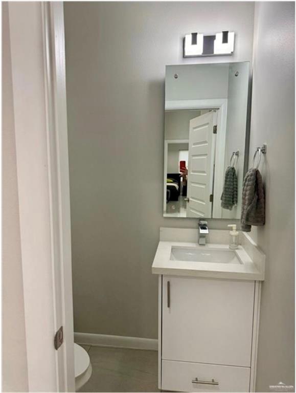 3120 East Rabbit Run Avenue Alton, TX 78573 - Photo 16 of 21 a bathroom with a sink and a mirror