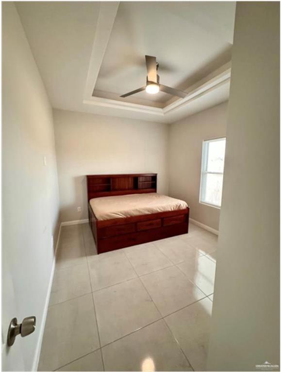 3120 East Rabbit Run Avenue Alton, TX 78573 - Photo 21 of 21 a bedroom with a bed and a ceiling fan