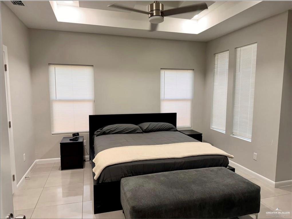 3120 East Rabbit Run Avenue Alton, TX 78573 - Photo 7 of 21 a bedroom with a bed and window