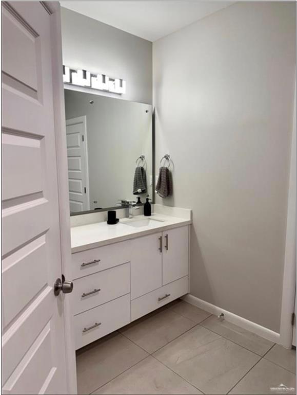 3120 East Rabbit Run Avenue Alton, TX 78573 - Photo 10 of 21 a bathroom with a sink and mirror