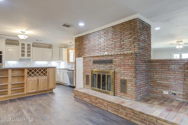 a kitchen with stainless steel appliances granite countertop a stove and a refrigerator