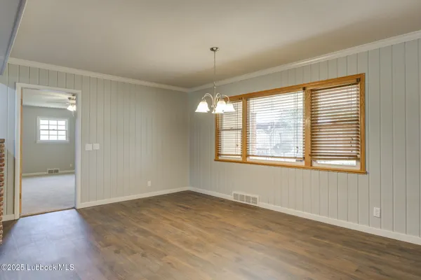 a view of a livingroom with wooden floor