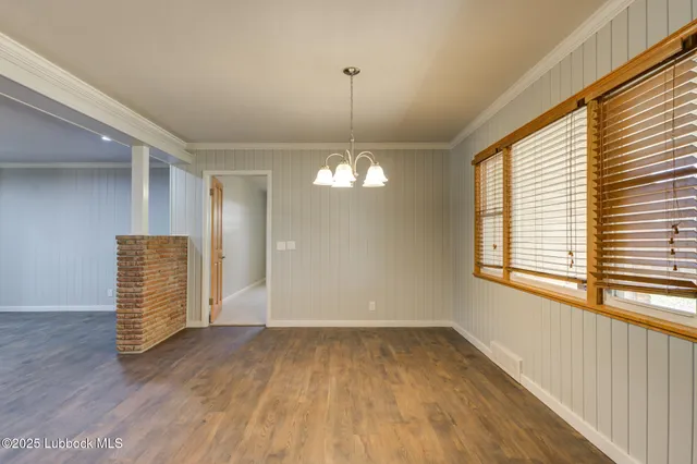 a view of kitchen with stainless steel appliances granite countertop a stove a sink and a refrigerator