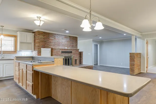a kitchen with granite countertop a sink and a window