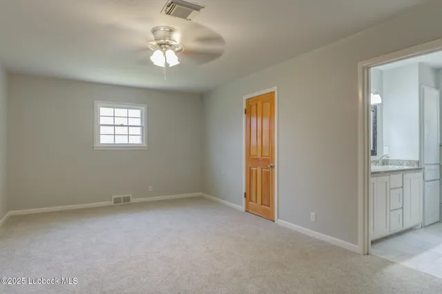a view of walk in closet with clothes