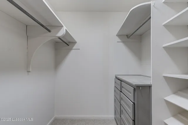 a view of a house with yard and a tree