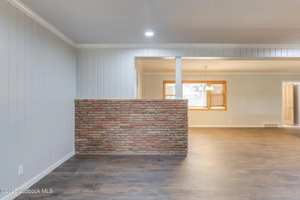 a view of kitchen with furniture and wooden floor