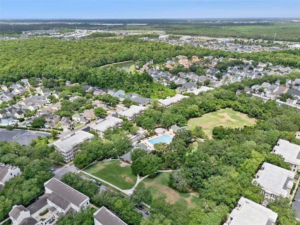 908 Croton Road Celebration, FL 34747 - Photo 64 of 86 an aerial view of residential houses with outdoor space and trees