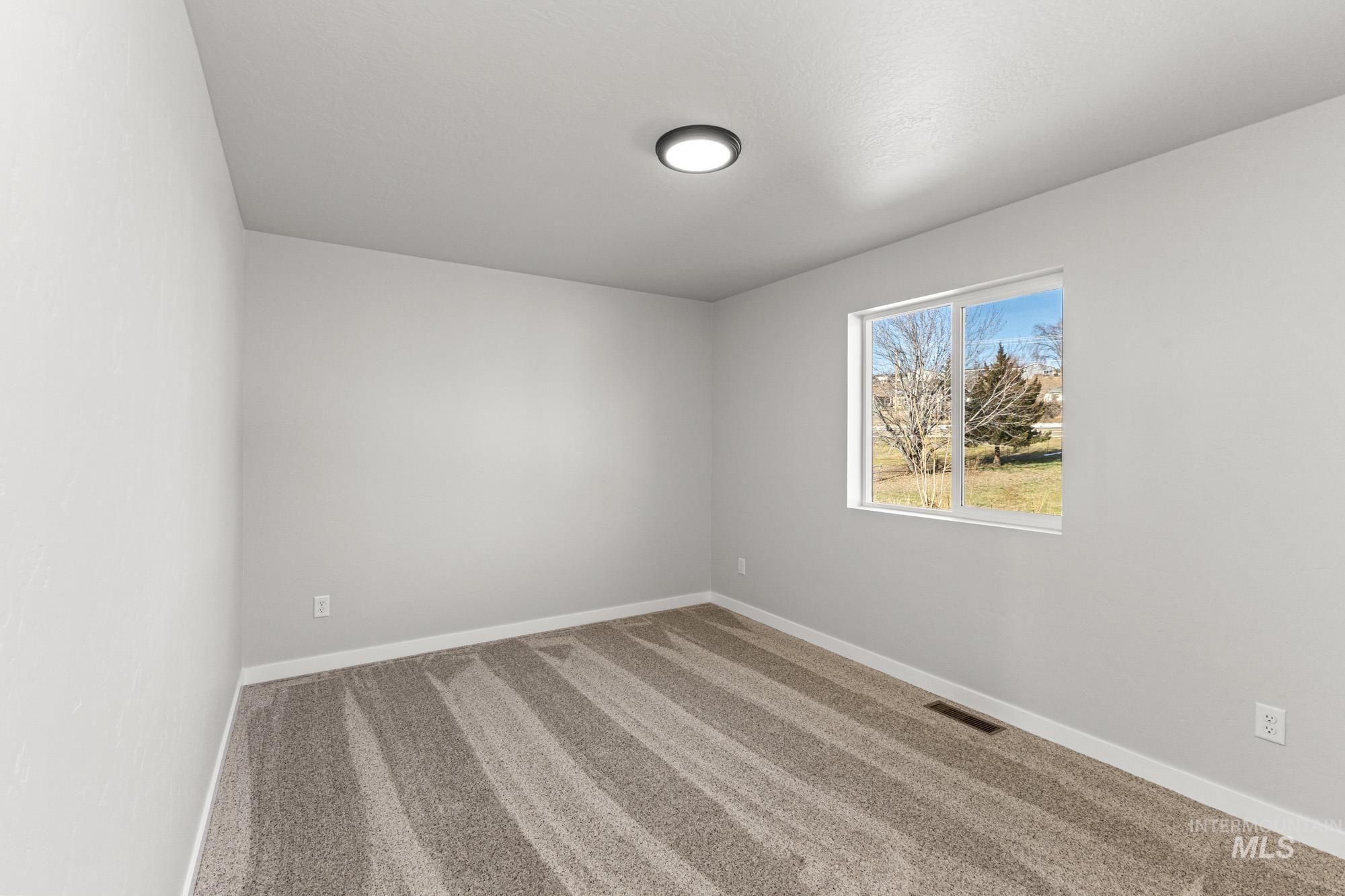1436 Long Pond Street Middleton, ID 83644 - Photo 14 of 24 Spare room with carpet and baseboards