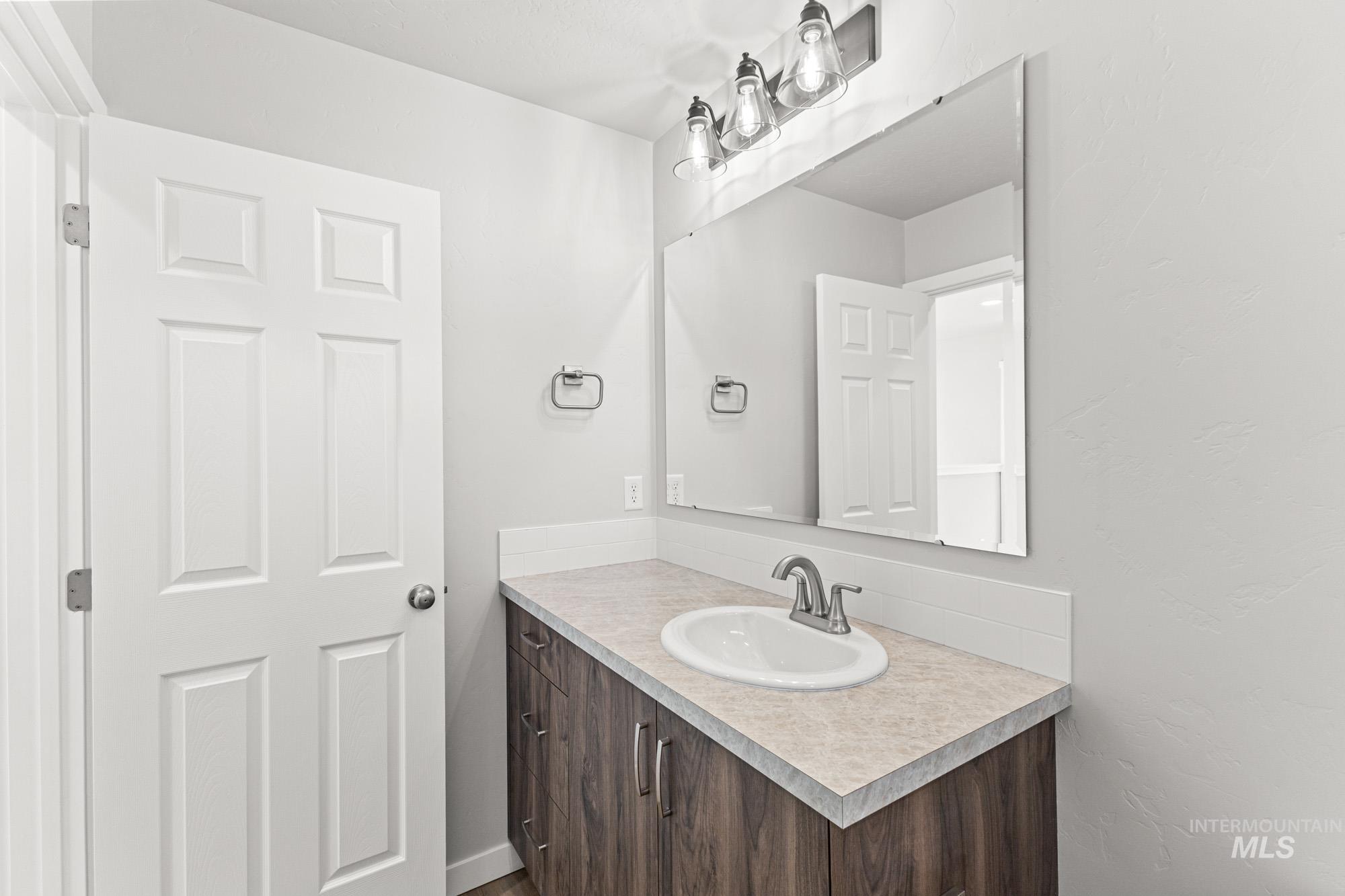 1436 Long Pond Street Middleton, ID 83644 - Photo 16 of 24 Bathroom with vanity and a textured wall