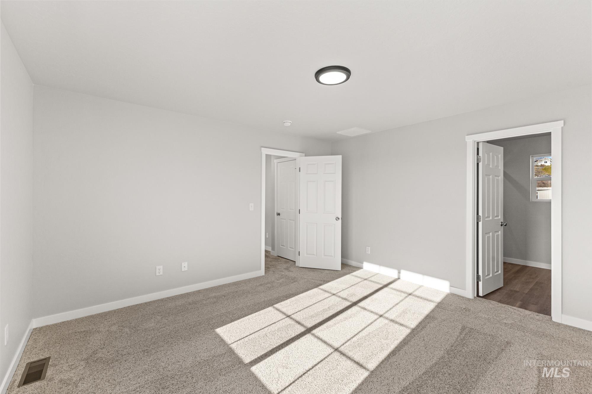 1436 Long Pond Street Middleton, ID 83644 - Photo 20 of 24 Unfurnished bedroom featuring carpet and a spacious closet
