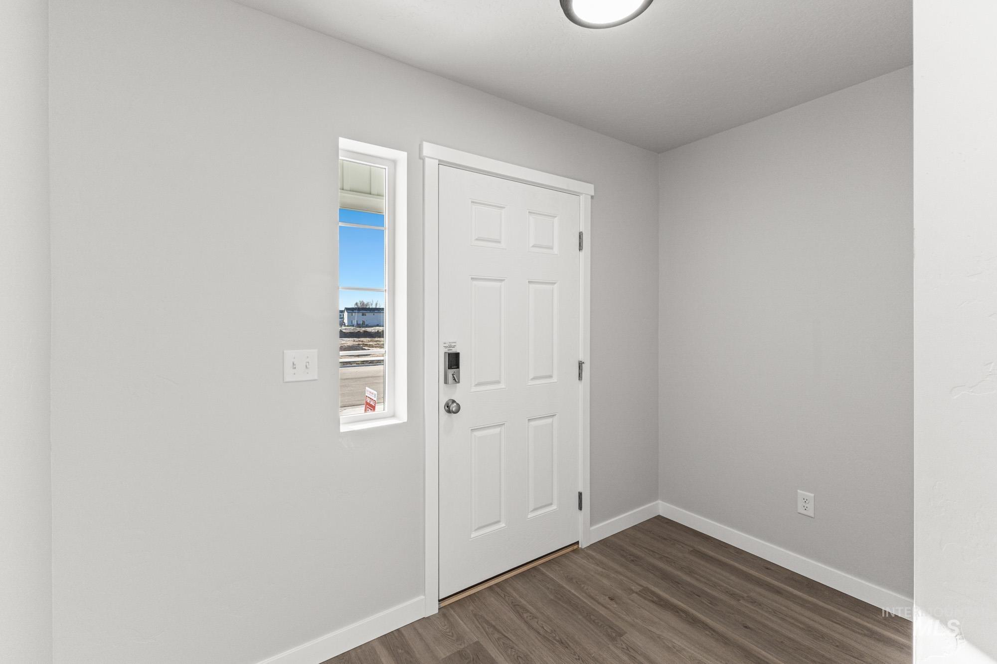 1436 Long Pond Street Middleton, ID 83644 - Photo 3 of 24 Foyer with dark wood finished floors and baseboards