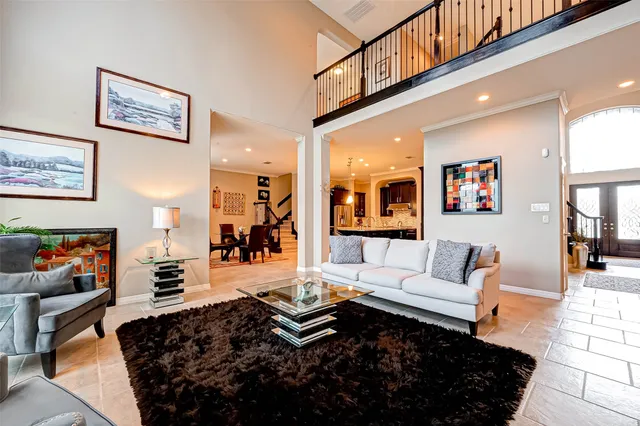 a living room with furniture and a rug