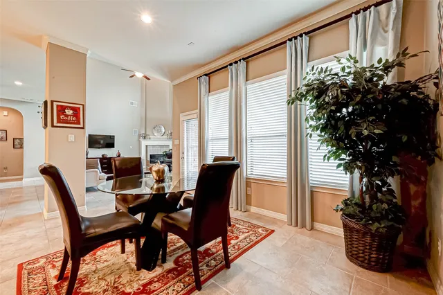 a view of a livingroom with furniture and a potted plant
