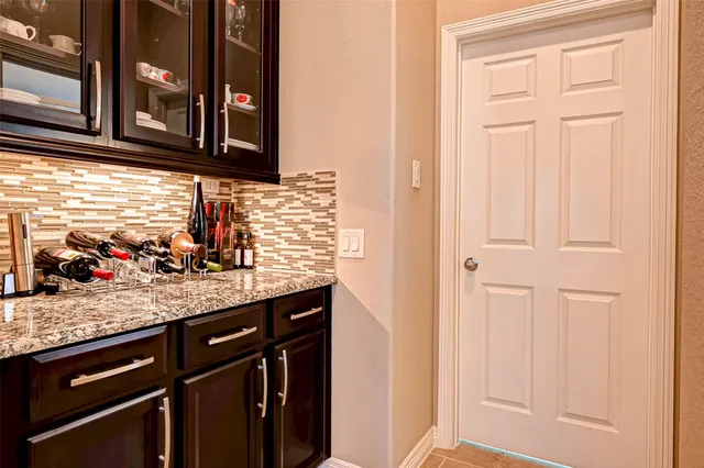 a kitchen with stainless steel appliances granite countertop a sink and a microwave