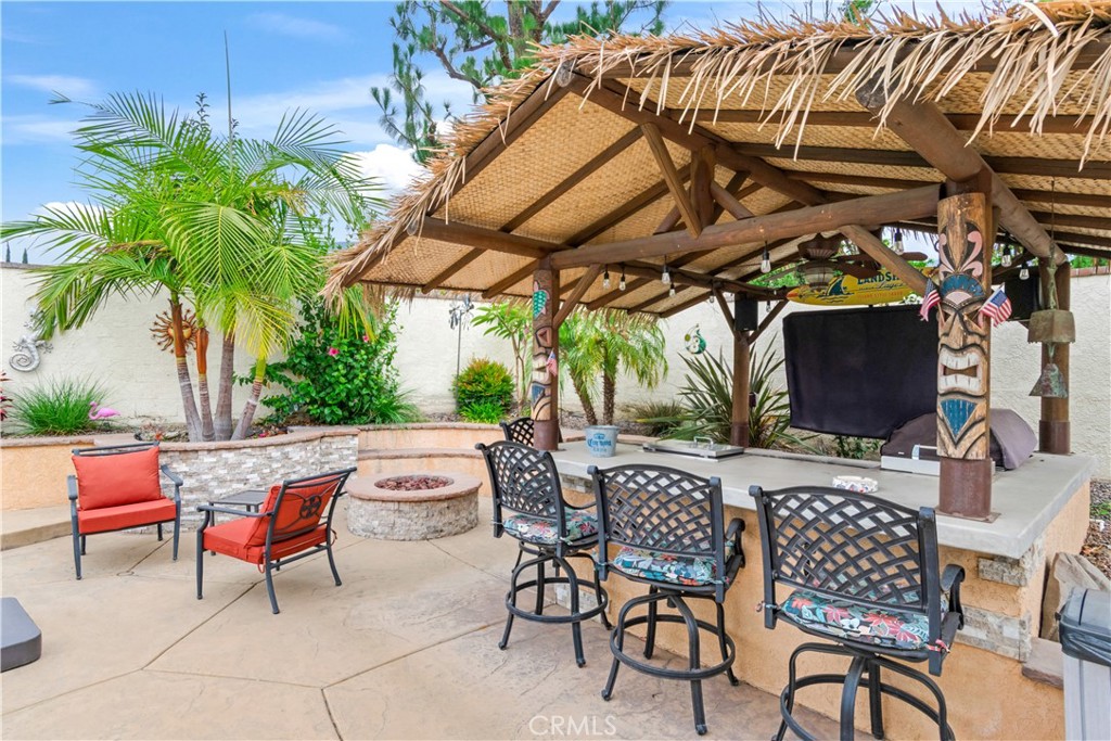 2429 Cliff Road Upland, CA 91784 - Photo 37 of 44 BBQ Tiki area and fire pit next to pool with beautiful landscaping