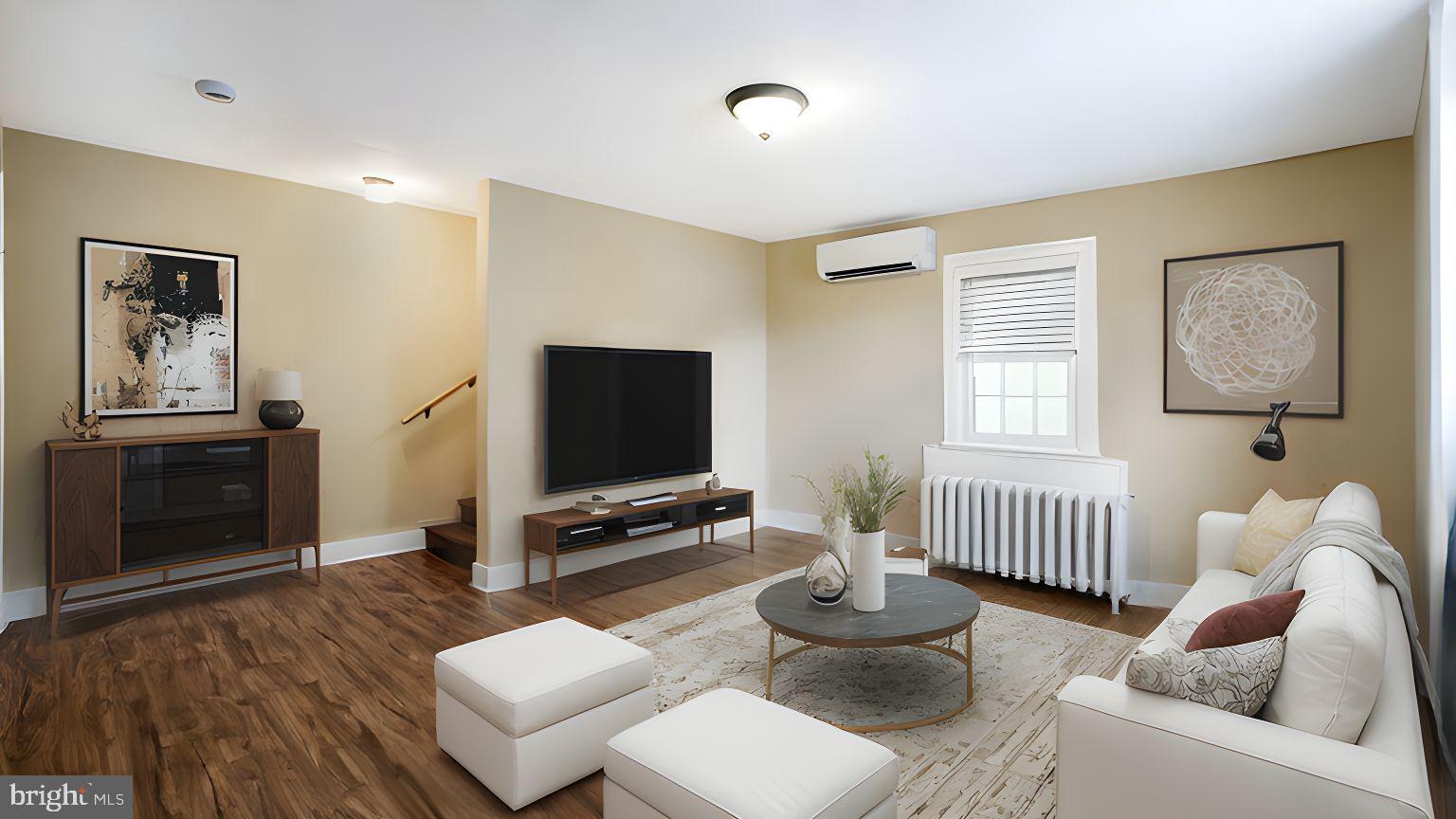 112 East State Street, Unit 6 Doylestown, PA 18901 - Photo 6 of 17 a living room with furniture and a flat screen tv