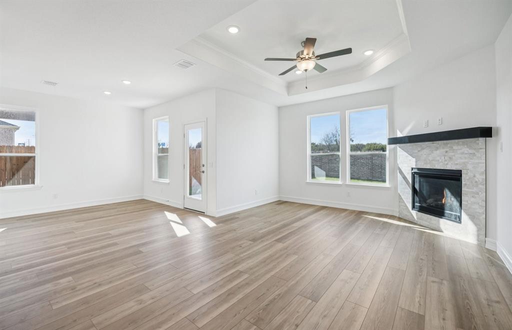 829 Norfolk Lane Godley, TX 76044 - Photo 6 of 21 Living room open to kitchen and dining