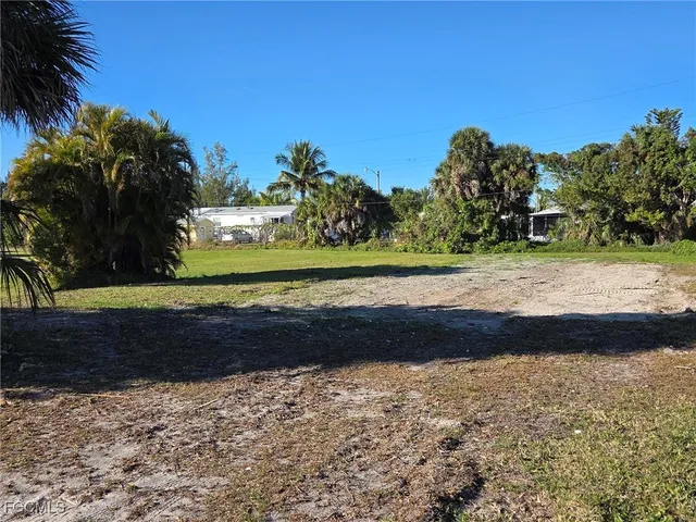 a view of a yard with a street