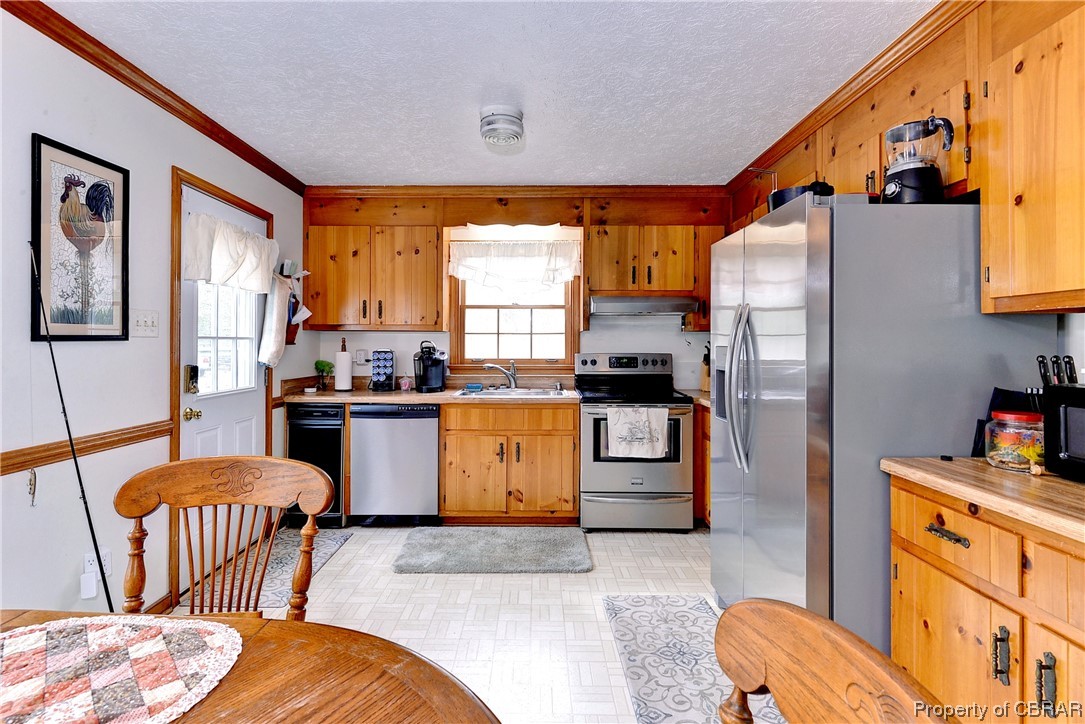 5301 North Courthouse Road Providence Forge, VA 23140 - Photo 9 of 26 a kitchen with a refrigerator and wooden floor