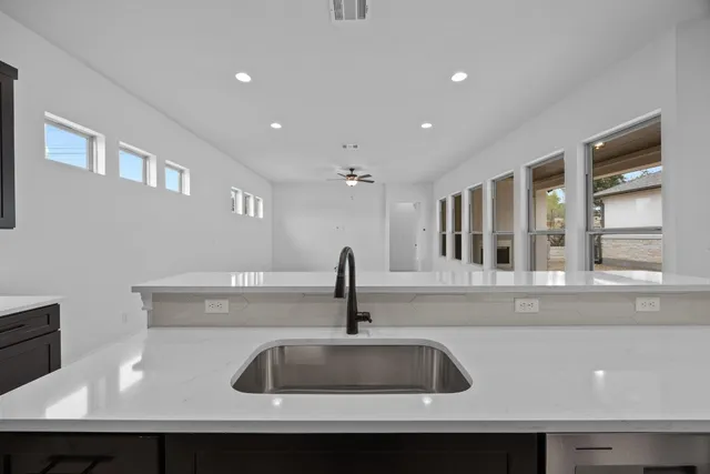 a kitchen with a sink and a window
