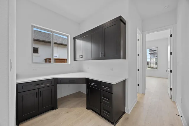 a kitchen with a sink and cabinets