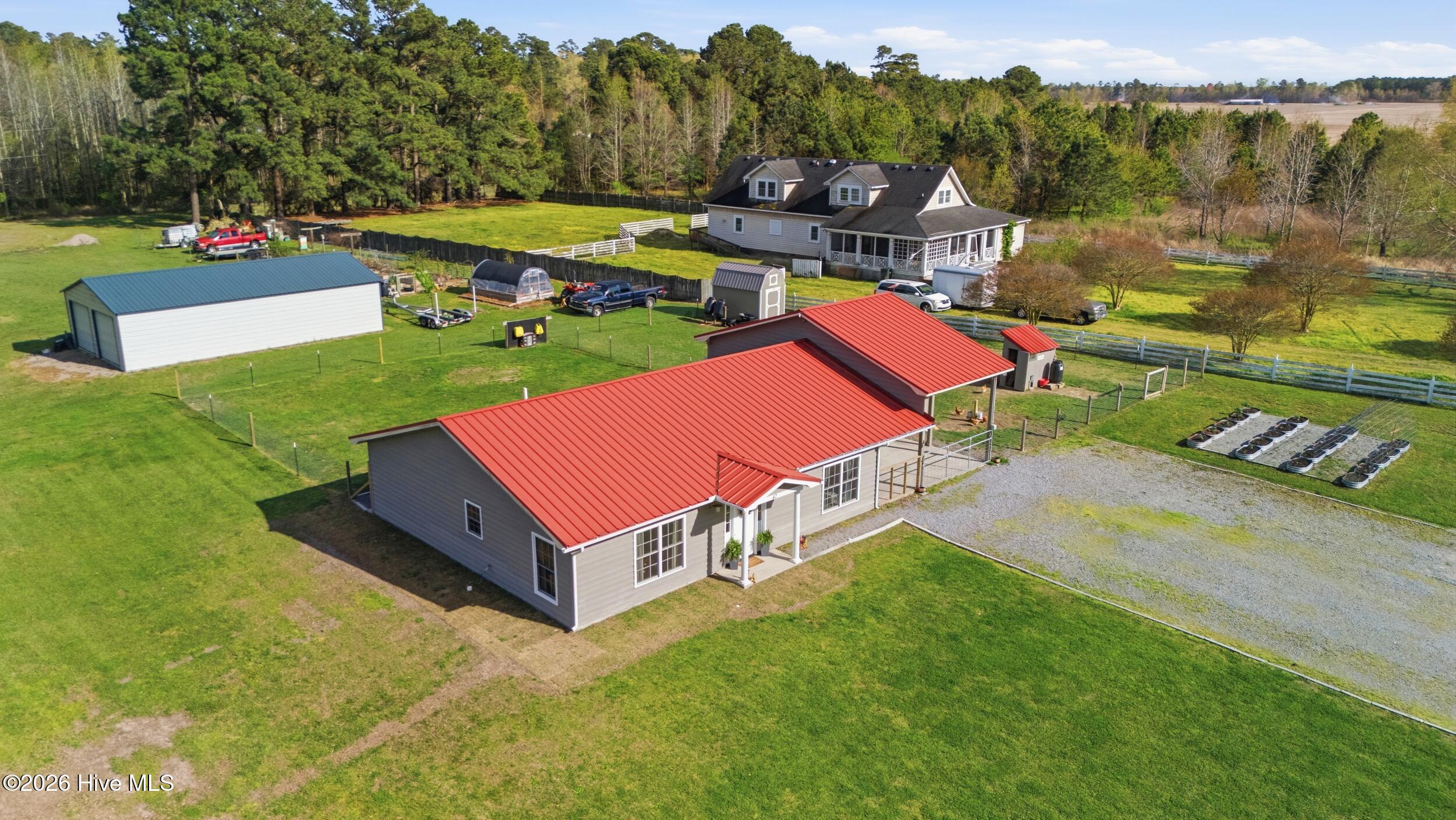 42 Ruby Lane Roper, NC 27970 - Photo 27 of 32 Lush green grass, garden beds, fencing and more!