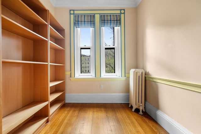 a view of a building with a brick wall