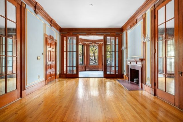 a view of an entryway with a door and a fireplace