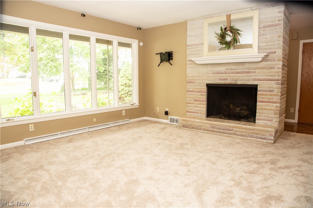 121 South Tamarack Road Akron, OH 44319 - Photo 14 of 35 Living Room with wrap around brick fireplace and new carpet