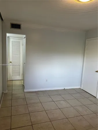 an empty room with white walls