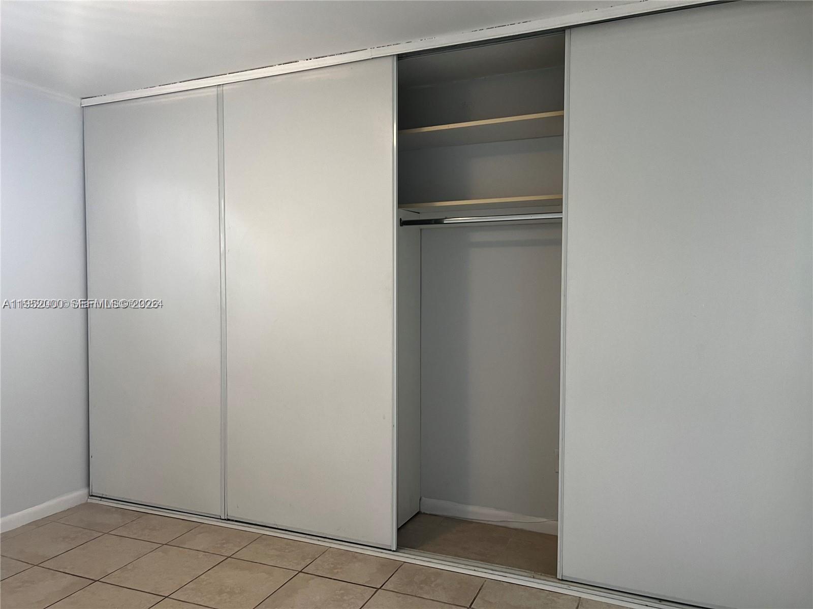 4111 Stirling Road, Unit 308 Fort Lauderdale, FL 33314 - Photo 19 of 32 a view of an empty walk in closet