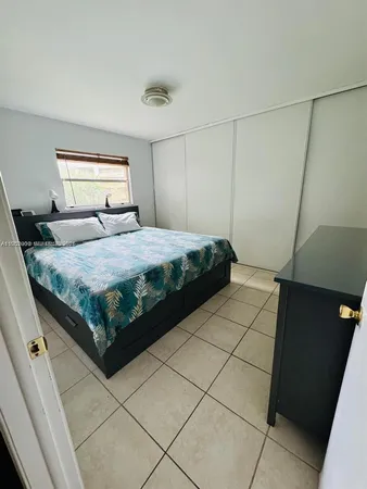 a bedroom with a bed and a cabinets