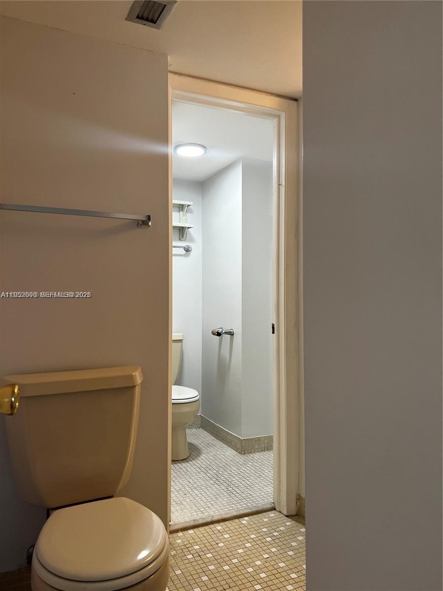 4111 Stirling Road, Unit 308 Fort Lauderdale, FL 33314 - Photo 25 of 32 a bathroom with a toilet