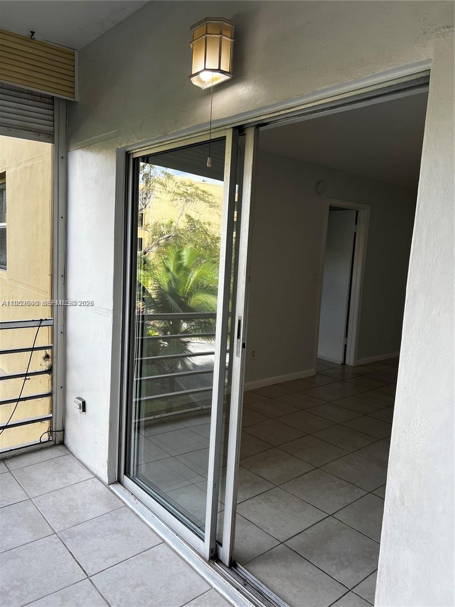 4111 Stirling Road, Unit 308 Fort Lauderdale, FL 33314 - Photo 31 of 32 a view of entryway with a door