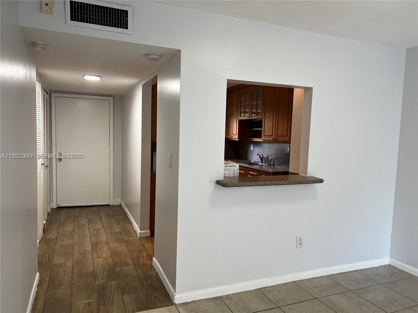 4111 Stirling Road, Unit 308 Fort Lauderdale, FL 33314 - Photo 8 of 32 wooden floor in an empty room