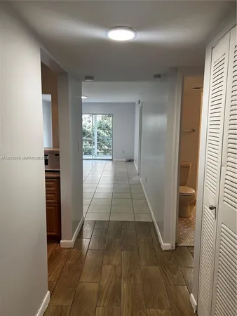 a view of entryway with wooden floor