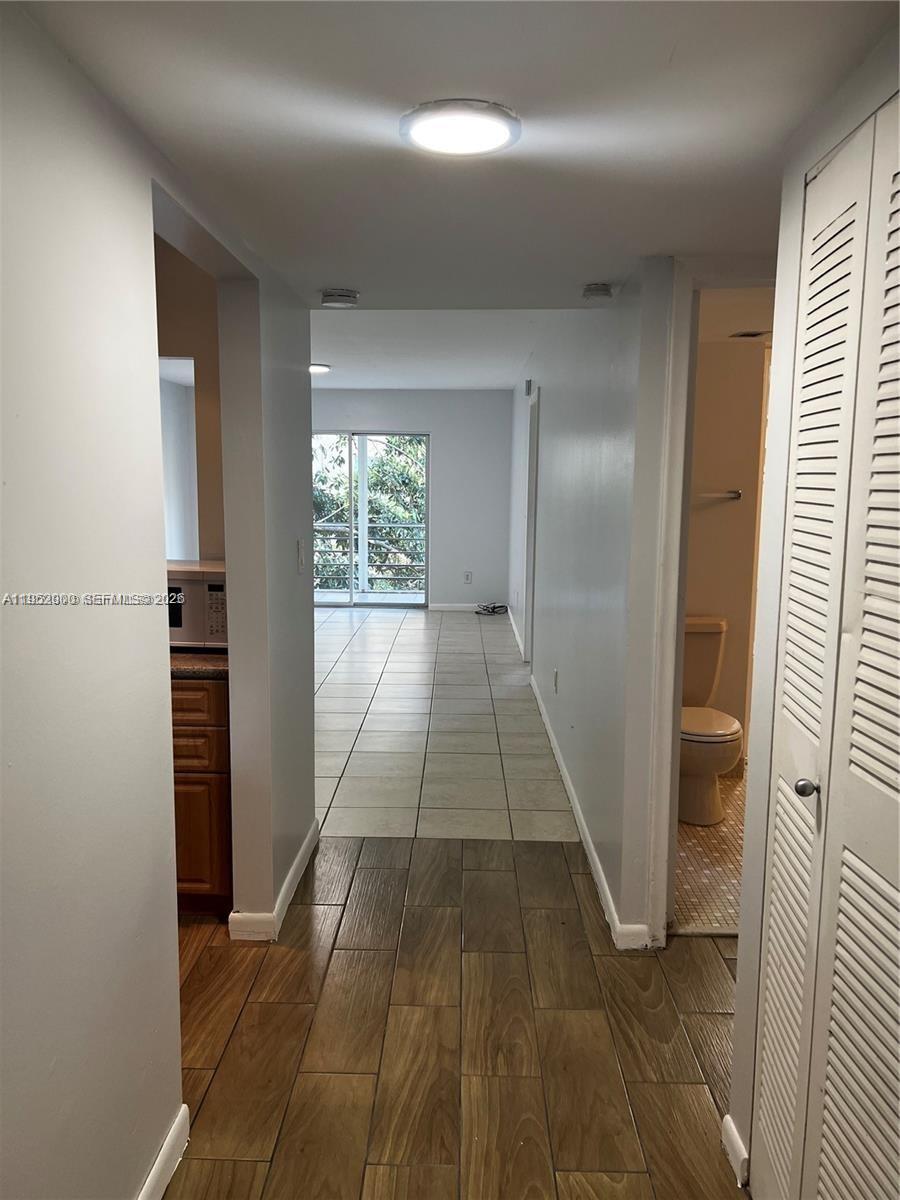 4111 Stirling Road, Unit 308 Fort Lauderdale, FL 33314 - Photo 10 of 32 a view of entryway with wooden floor