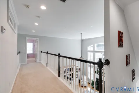 a view of a hallway with windows