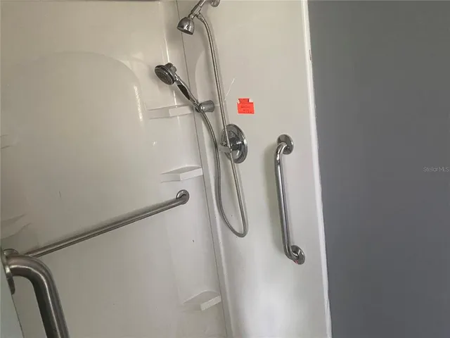 a kitchen with a refrigerator and window