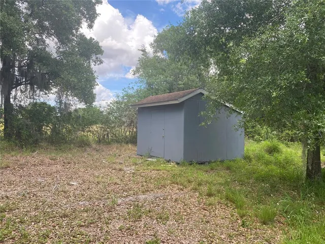 a backyard of a house with lots of green space