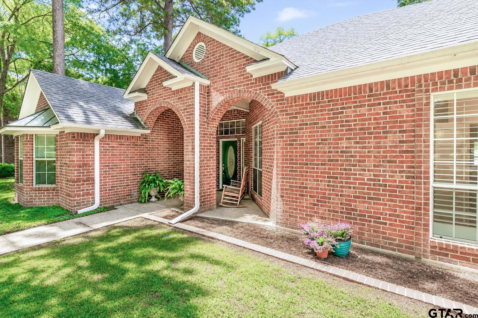 1388 Santa Fe Trail Tyler, TX 75703 - Photo 3 of 46 a front view of a house with a garden and plants