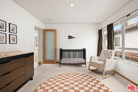 a view of a house with backyard porch and sitting area