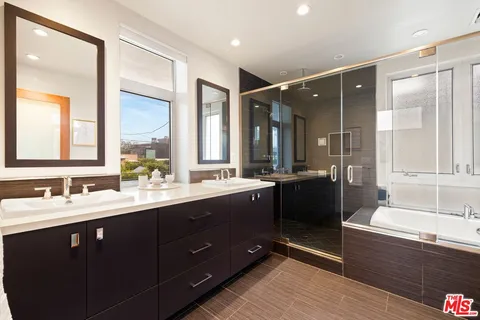 a kitchen with a refrigerator and a sink