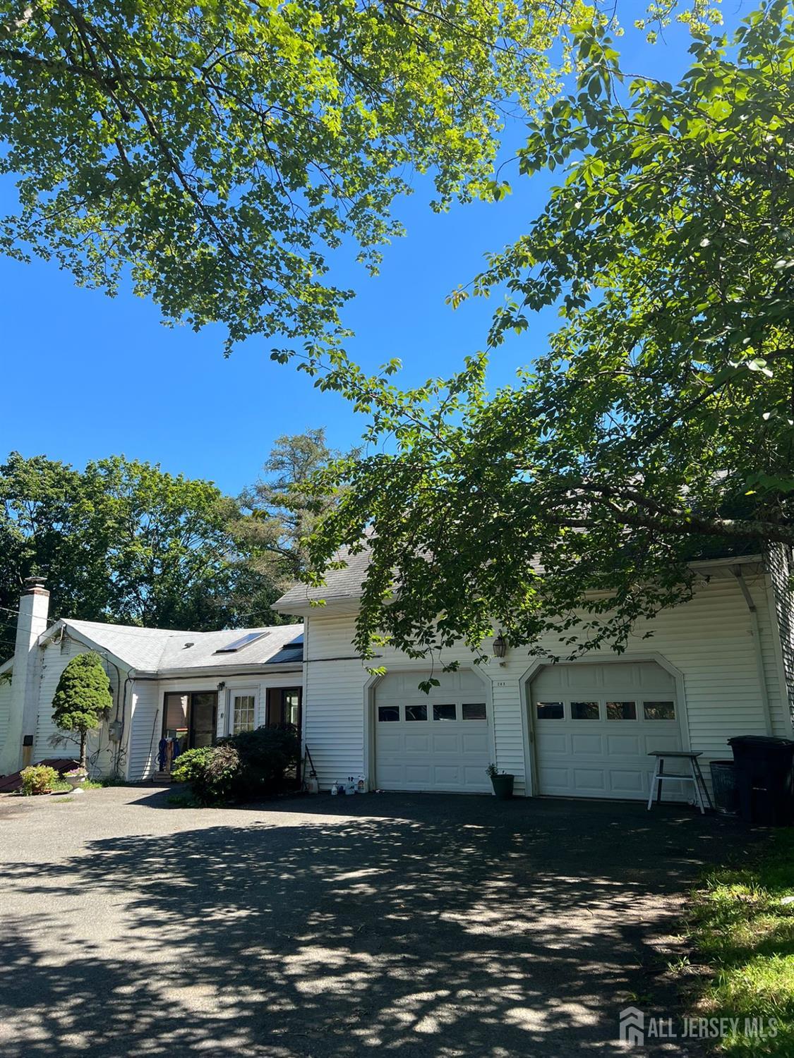 265 Friendship Road Cranbury, NJ 08512 - Photo 1 of 15 a front view of a house with a yard